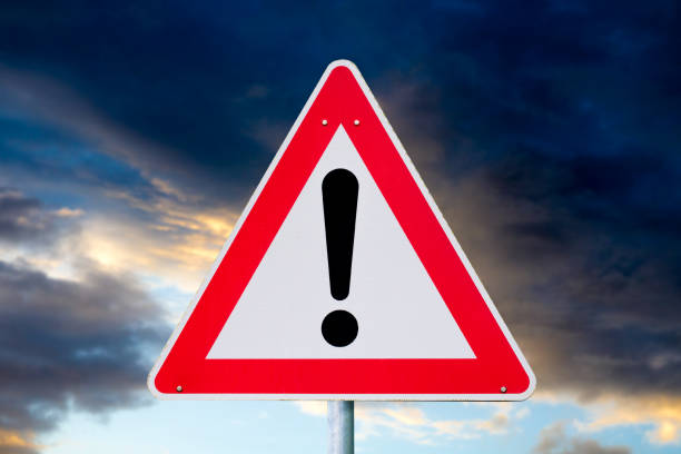 istock winter driving - warning sign - risk of snow and ice 1124764518