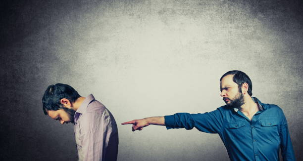 istock Multiple Image Of Man Pointing Against Gray Wall 1124766566