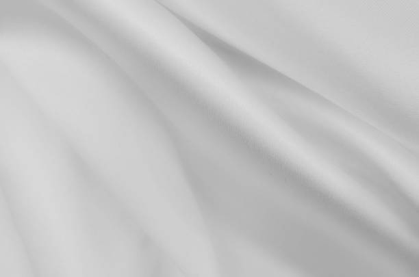 istock Smooth elegant white silk or satin luxury cloth texture. Can use as wedding background. 1124769475