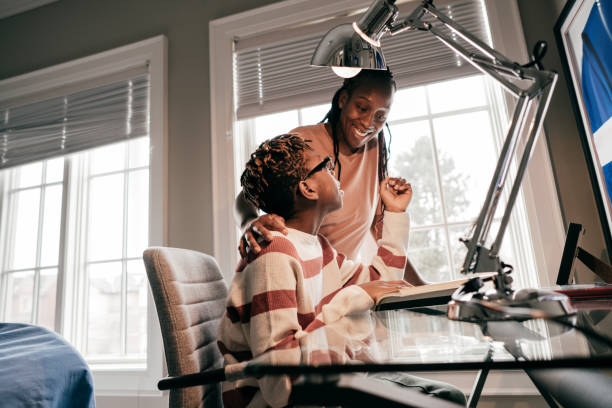 istock Helping your child with his homework 1124770117