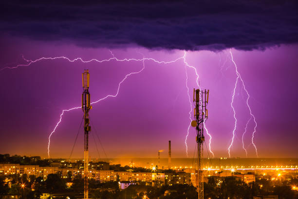 storm lightning on the horizon over the city of Dnieper storm lightning on the horizon over the city of Dnieper lightning tower stock pictures, royalty-free photos & images