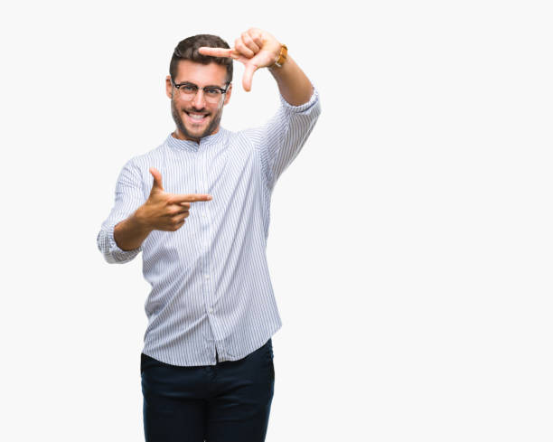 istock Young handsome man over isolated background smiling making frame with hands and fingers with happy face. Creativity and photography concept. 1124773066