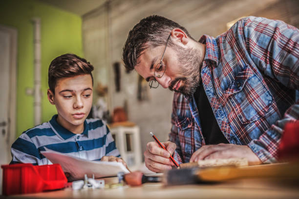 istock Father and Son Assembling Furniture 1124774309
