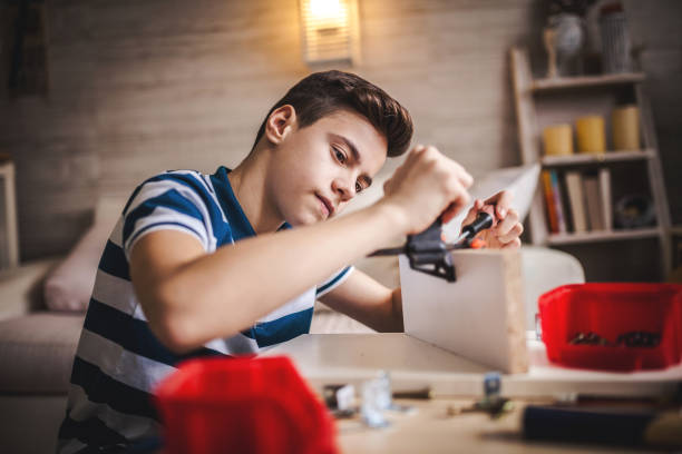 istock Father and Son Assembling Furniture 1124774670