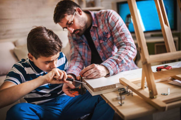istock Father and Son Assembling Furniture 1124775188