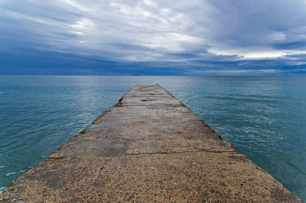 istock View from the breakwater towards the sea horizon. 1124778145