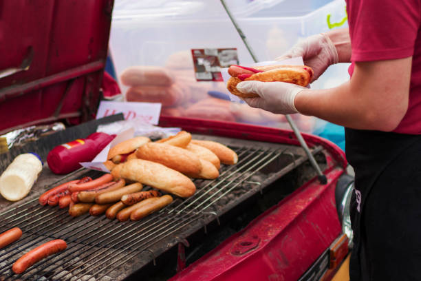 istock A man is cooking hot dogs 1124779470