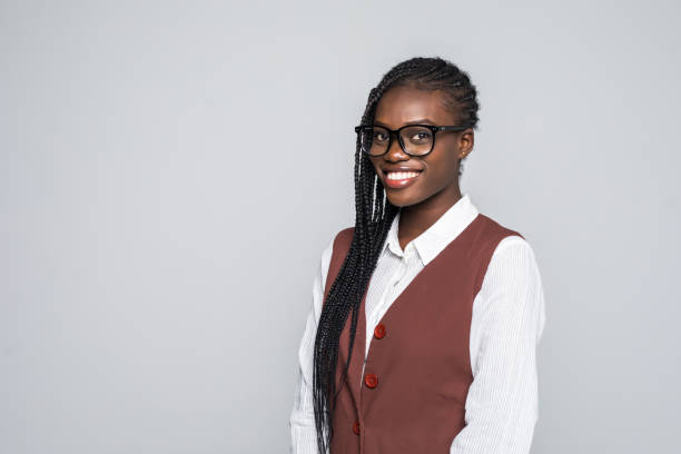 istock Young african woman with glasses isolated on grey background 1124779649