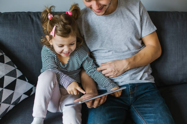 istock happy family with tablet 1124780662