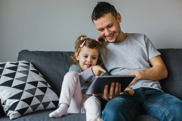 istock happy family with tablet 1124780779