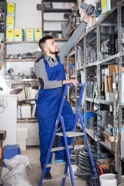 istock Nice male worker looking through sanitary drain pipes 1124781768