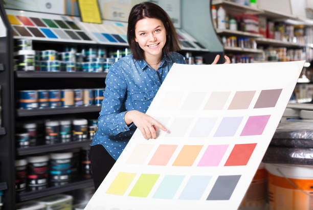 istock Smiling woman checking color scheme 1124782433