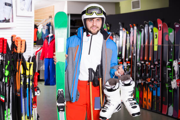 istock man standing with purchased ski gear 1124782485