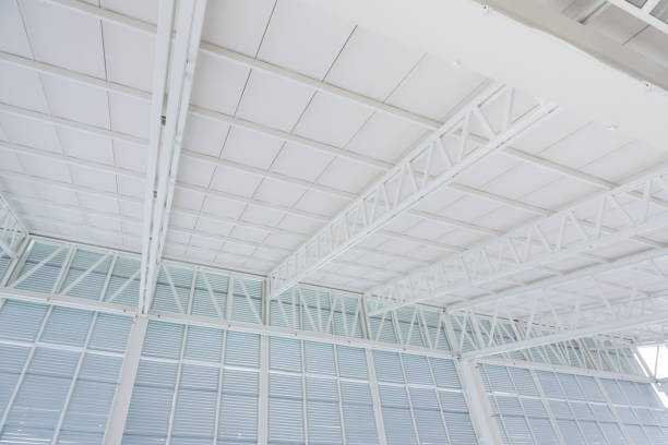 istock Large steel structure truss, roof frame and metal sheet in building construction 1124785761