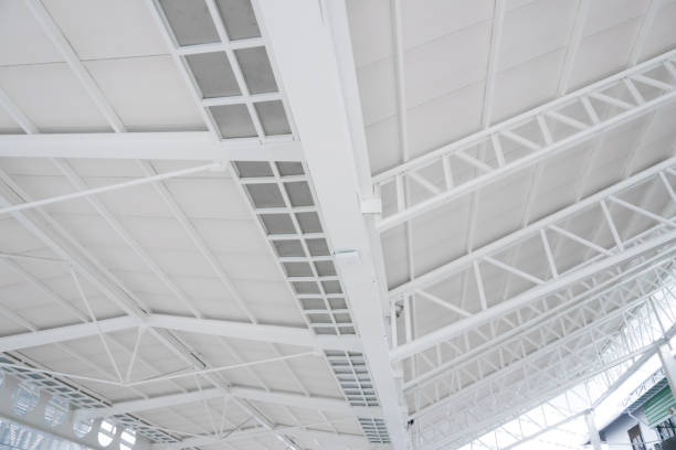 istock Large steel structure truss, roof frame and metal sheet in building construction 1124785857