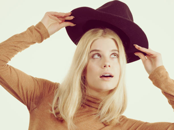 istock Woman wearing suede and black hat 1124787799