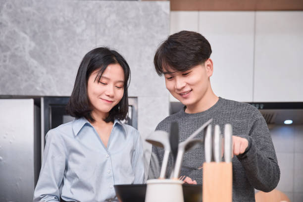 istock Young Chinese Couple in Kitchen 1124787946