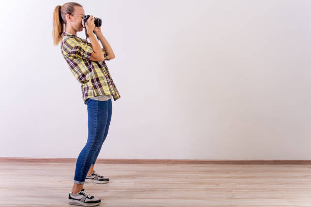istock different photographer poses: bending, squatting, lying down 1124790629