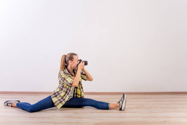 istock different photographer poses: bending, squatting, lying down 1124790684