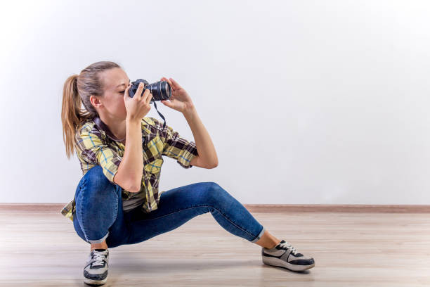 concept of different photographer poses: bending, squatting, lying down