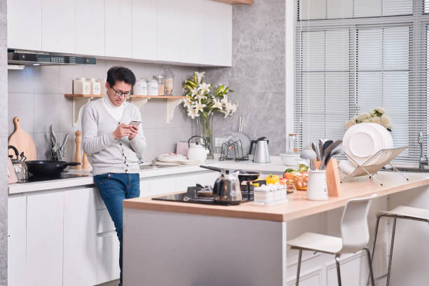 istock he can cook and stay connected at the same time 1124793577