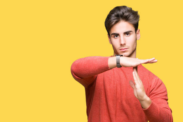istock Young handsome man over isolated background Doing time out gesture with hands, frustrated and serious face 1124797331