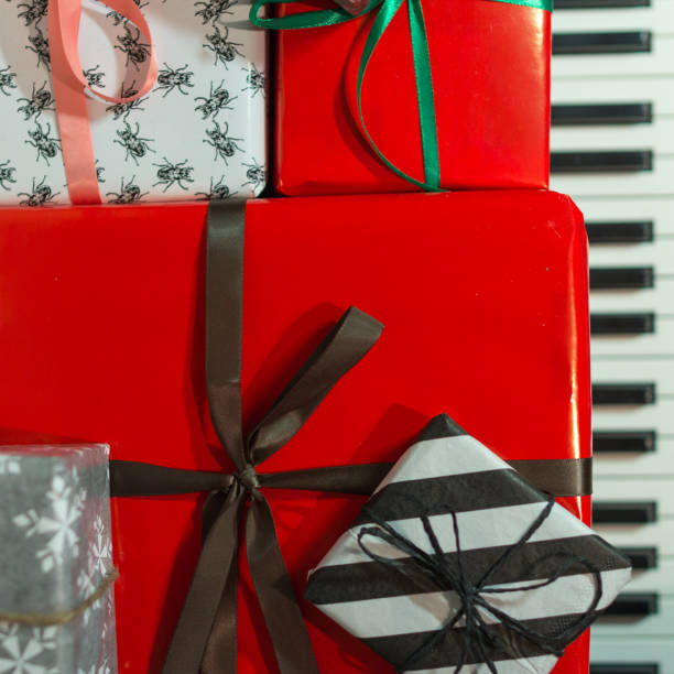 istock Colorful gift boxes on the piano. 1124799218