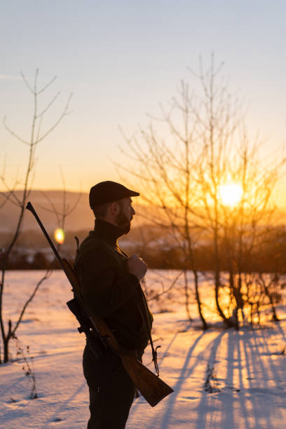 istock Portrait of young hunter at sunset 1124799858