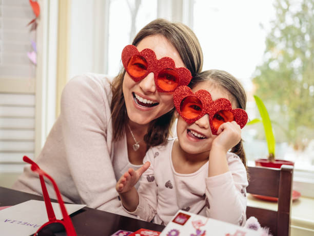istock Mother and young daughter crafting for Valentine's Day 1124800134