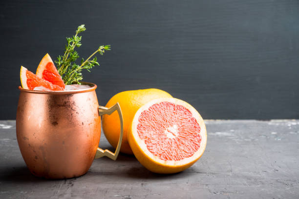 istock Grapefruit moscow mule in copper mug on the rustic background 1124801275