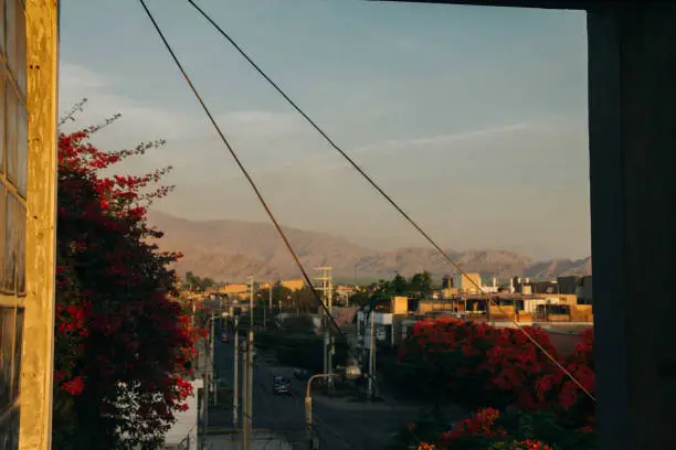 view of the city of ica, with mountains of the Andes mountain range in the background.