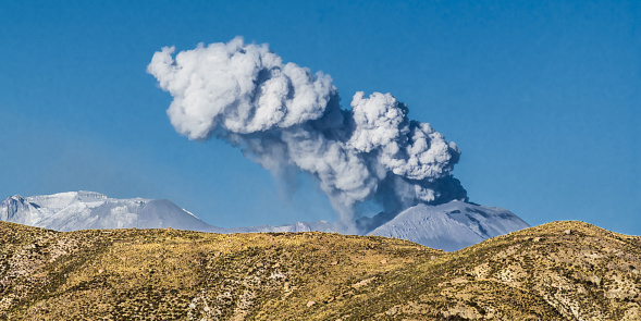 Thick smoke over the crater of sabankaya volcano in the Andes in Peru.