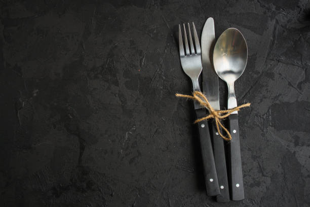 istock cutlery rustic, used for eating or serving (fork, knife, spoon - set). food background. copy space 1124804136
