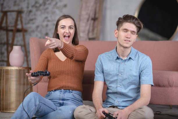 istock Millennial couple cheerfully gaming together 1124806513