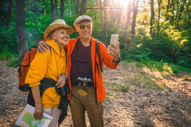 istock senior couple taking a selfie on their hiking journey 1124806739