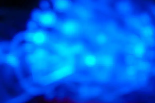 Photo of background blurred motion defocused texture. Blue disco waves lightings. for design or decor. abstract coloristic decoration.