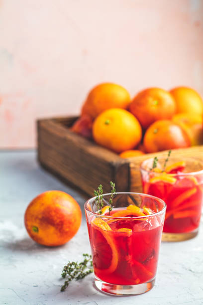 istock Blood orange margarita cocktail with ice and thyme 1124809886