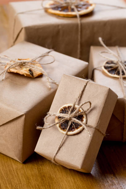 istock craft presents decorated with dry citrus on wooden background 1124814254