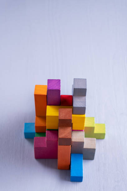 istock Abstract construction from wooden blocks shapes. 1124814490
