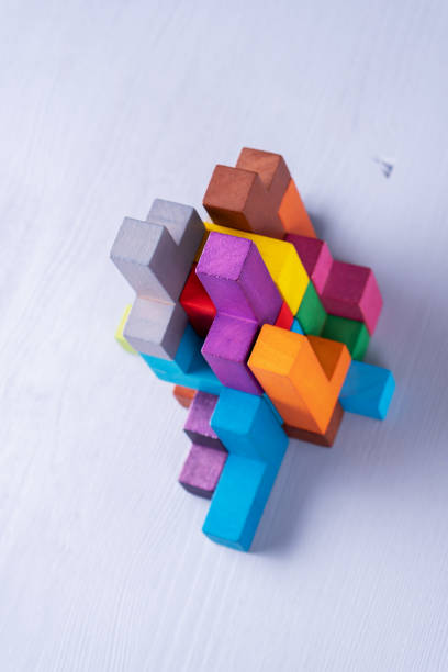 istock Abstract construction from wooden blocks shapes. 1124814516