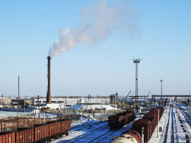 Factory chimney, WHITE thick smoke on the sky, RAILWAY STATION, RAIL, CARRIAGE stock photo