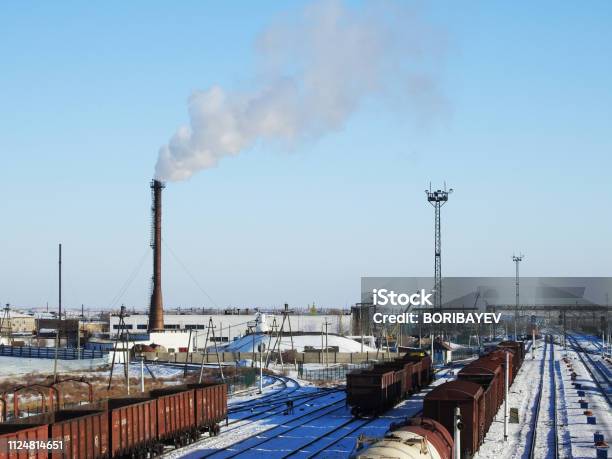 Factory Chimney White Thick Smoke On The Sky Railway Station Rail Carriage Stock Photo - Download Image Now