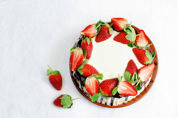 istock Sponge cake with cream, chocolate and strawberry 1124816029