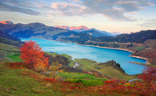 istock mountains and lake Roselend  with a dike 1124820612