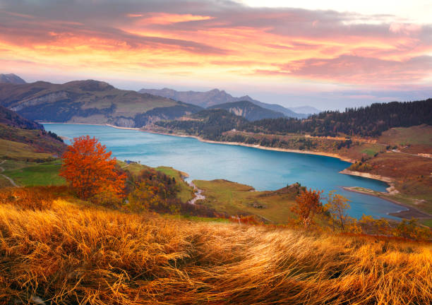 istock mountains and lake Roselend  with a dike 1124820794
