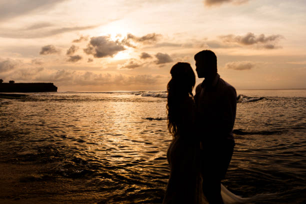 istock Newlyweds on the beach at sunset 1124824834