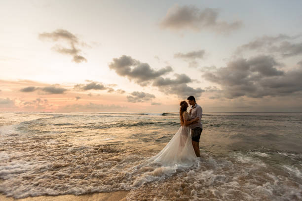 istock Newlyweds on the beach at sunset 1124826697
