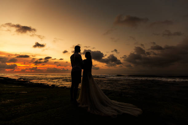 istock Newlyweds on the beach at sunset 1124826900