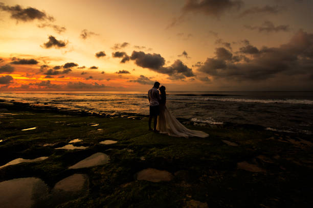 istock Newlyweds on the beach at sunset 1124826951