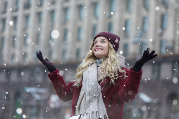 istock Young woman enjoying with snow 1124826994